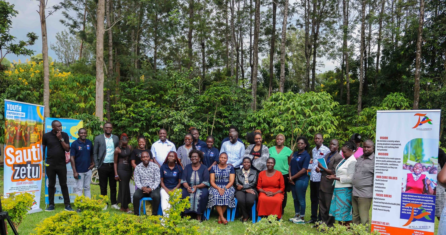 Full stakeholder group at the Sauti Zetu launch event, Sauti Zetu and Jenga AfriHub banners visible